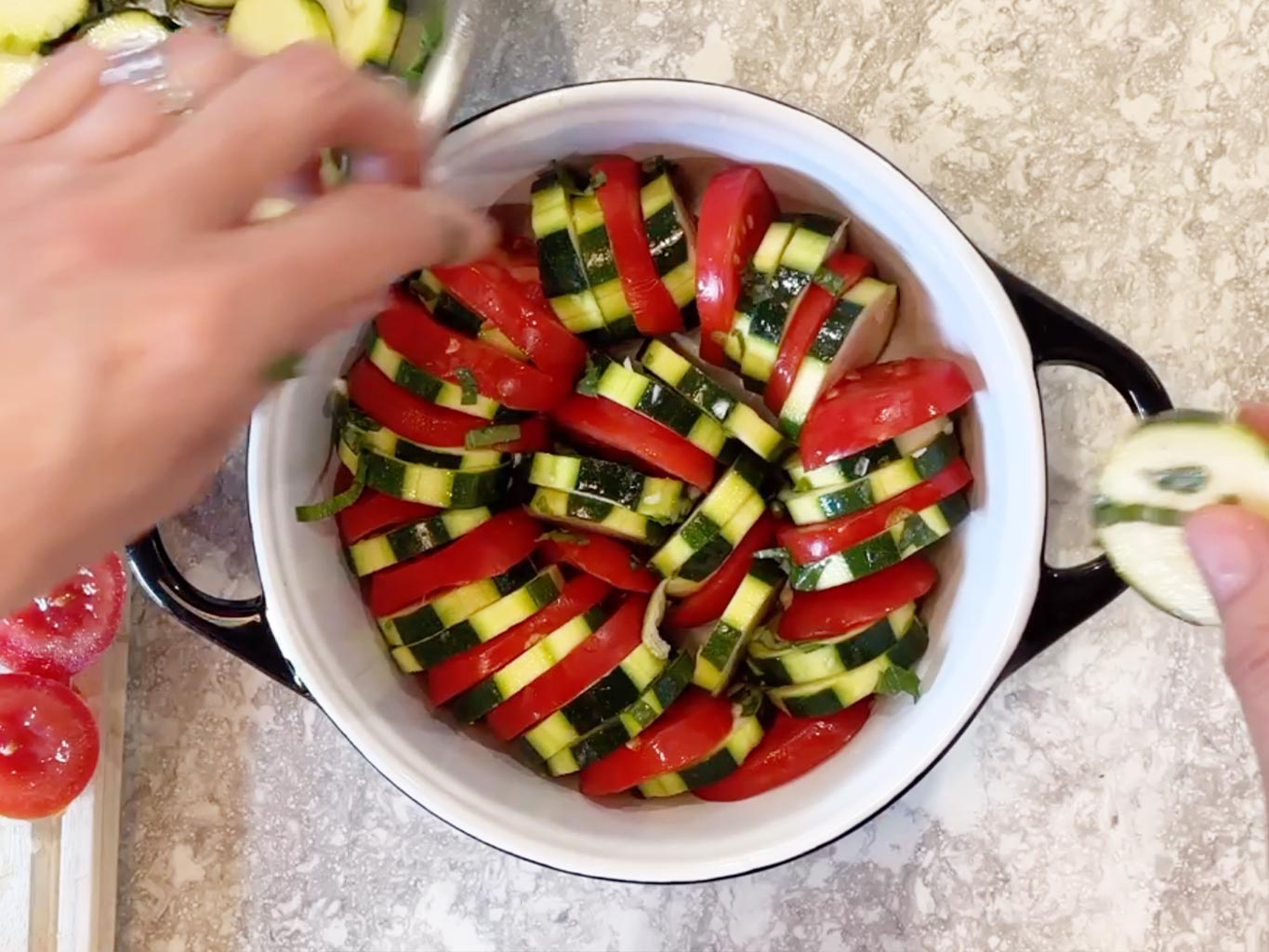 Arranging tomato and courgette slices