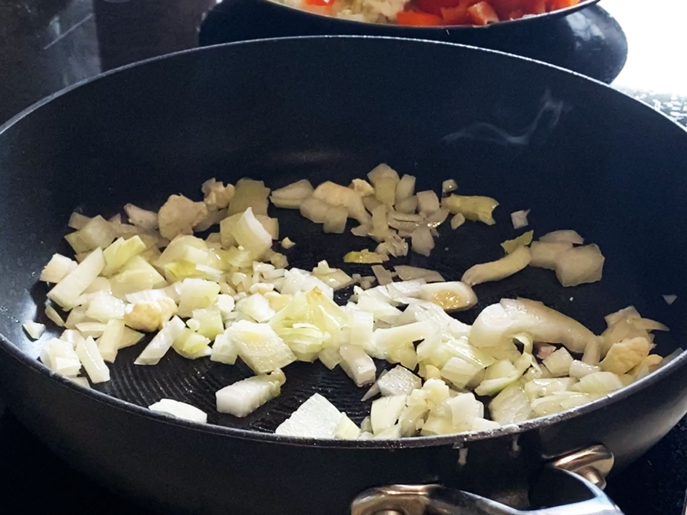 Sautรฉe onions and garlic in olive oil