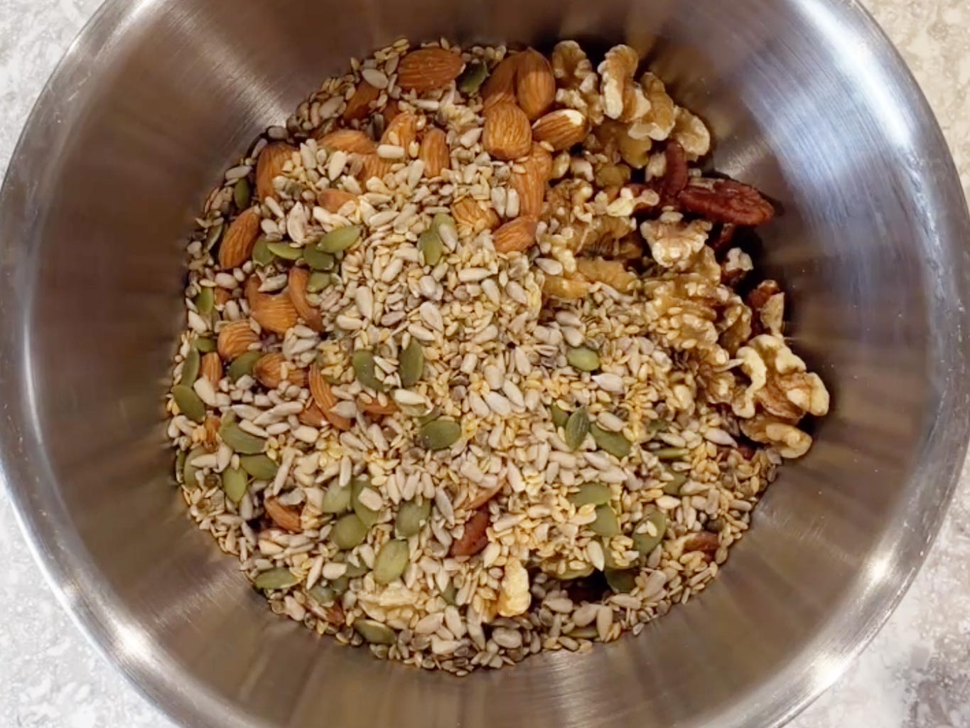 Add mixed nuts and seeds to a bowl