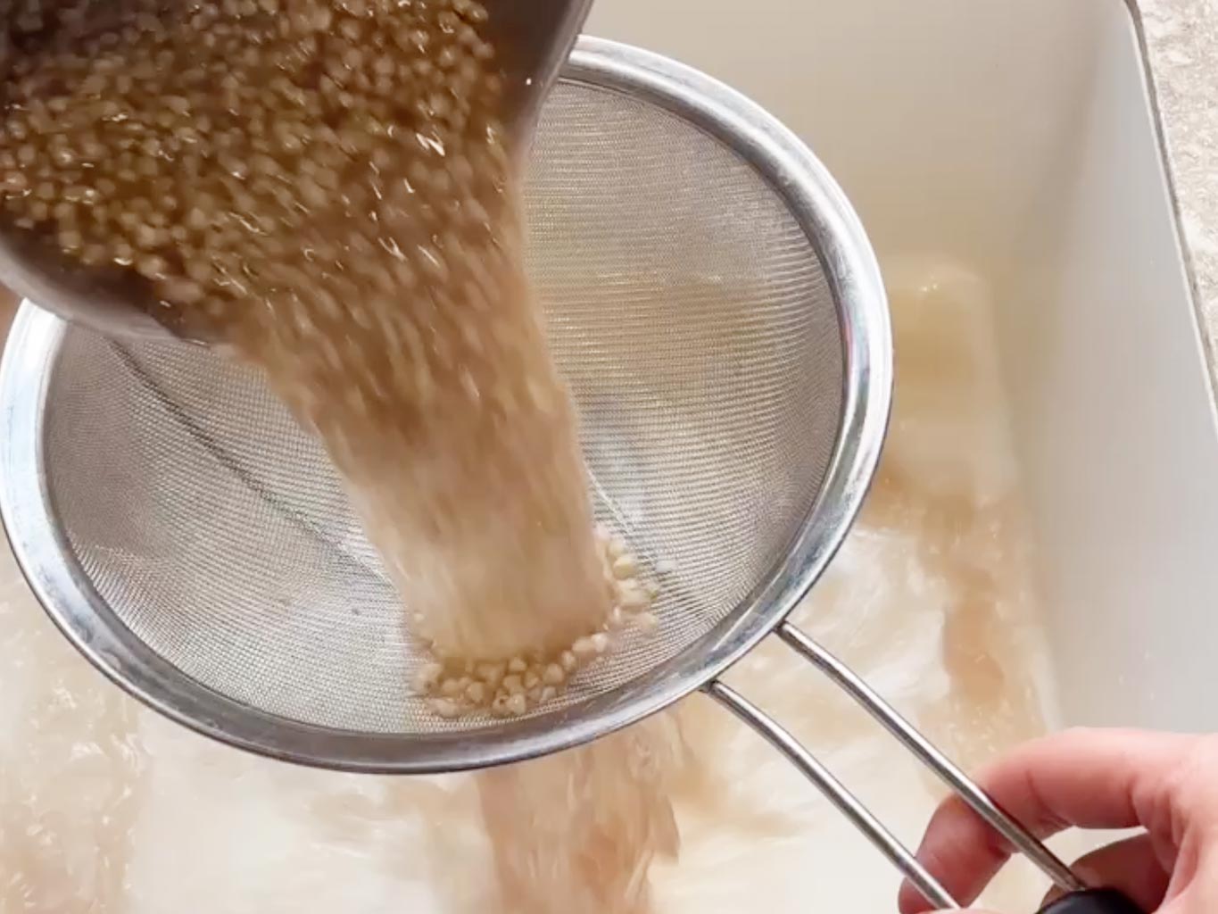 Drain and rinse buckwheat groats through a fine mesh sieve